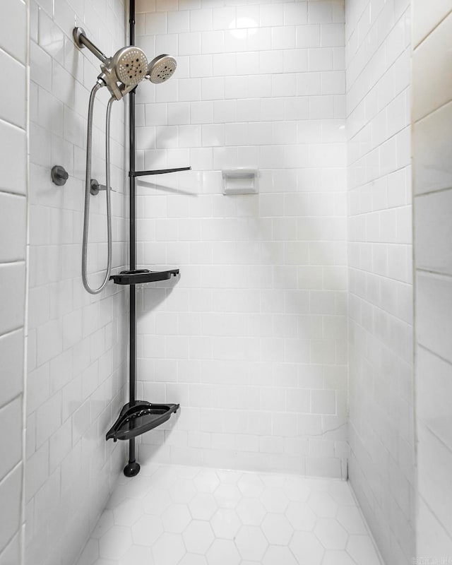 bathroom with a tile shower