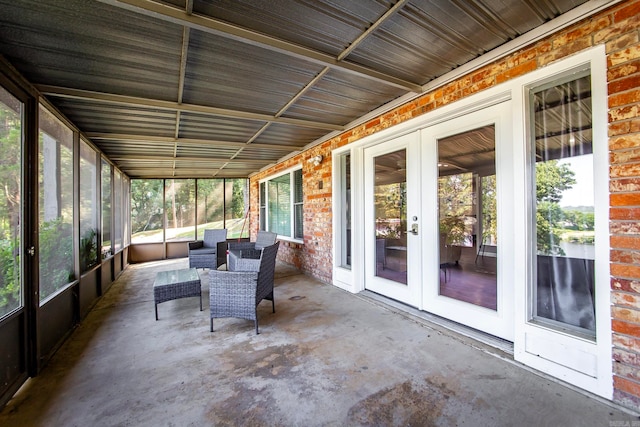 unfurnished sunroom with french doors