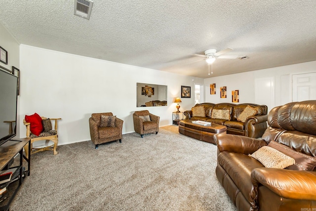 carpeted living room with a textured ceiling and ceiling fan