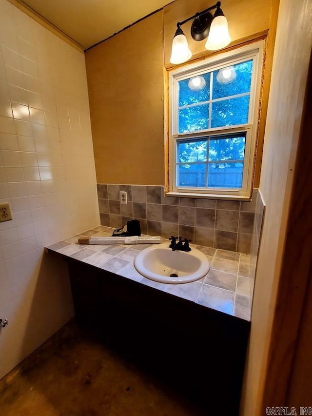 bathroom featuring tile walls and vanity