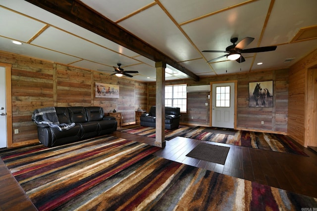 unfurnished living room featuring hardwood / wood-style flooring, recessed lighting, wood walls, and beam ceiling