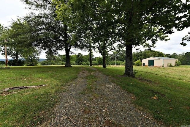 view of road featuring an outbuilding