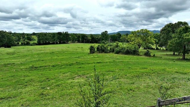 view of nature featuring a rural view and a mountain view