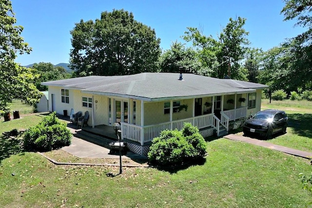 view of front of home with a porch and a front lawn