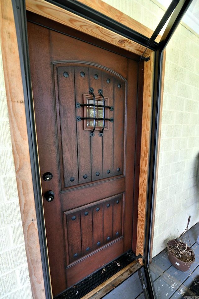 property entrance with brick siding