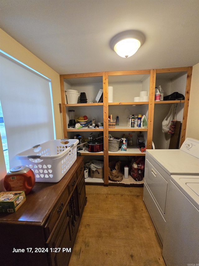 washroom with independent washer and dryer