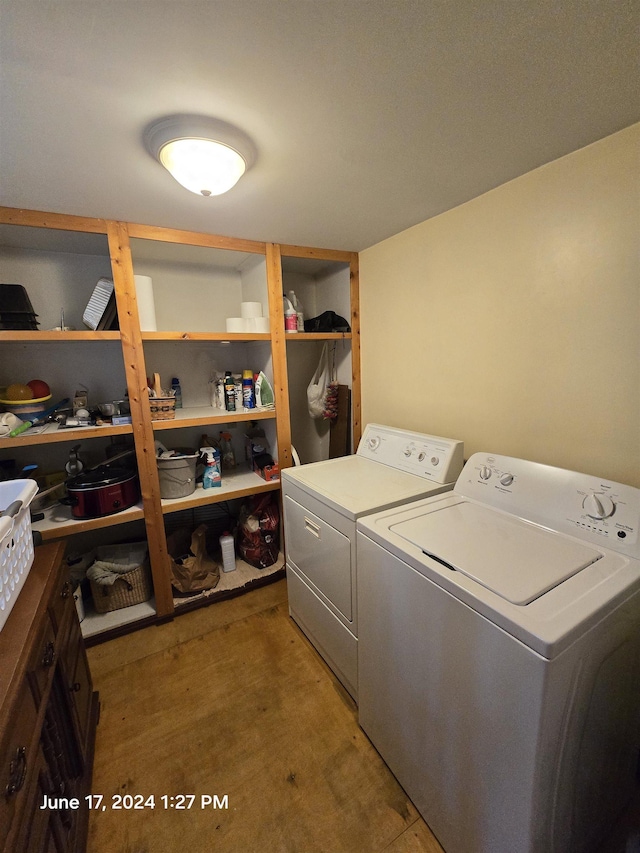 washroom featuring independent washer and dryer