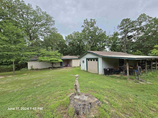 view of yard featuring a garage