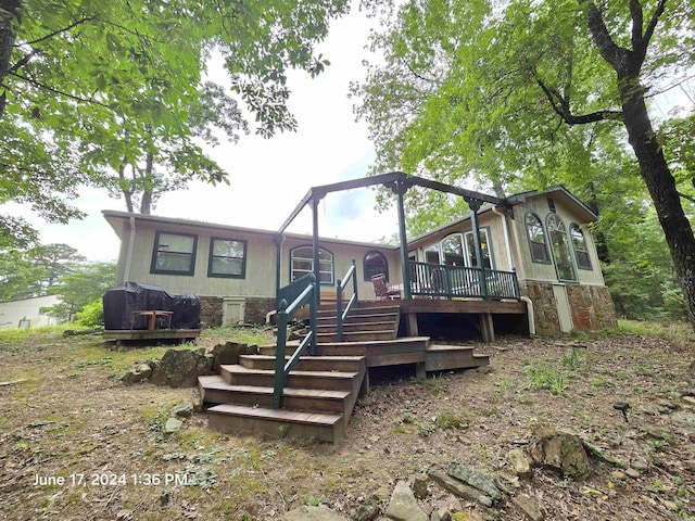 rear view of house with a deck