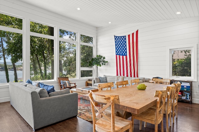 dining space featuring dark hardwood / wood-style floors and lofted ceiling