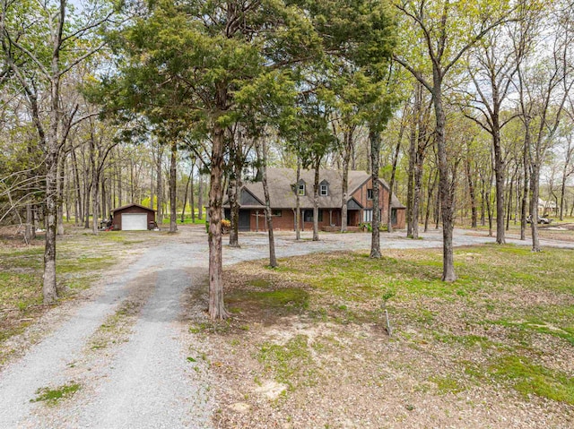 view of front of home featuring a garage and an outdoor structure