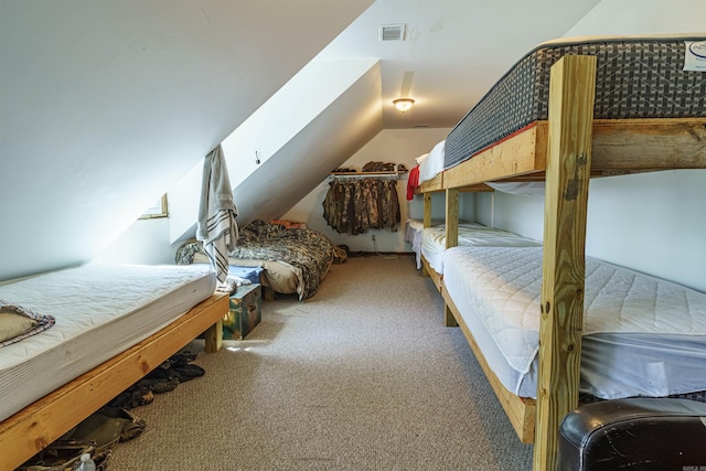 bedroom featuring carpet flooring and lofted ceiling