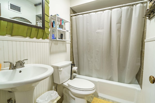 full bathroom featuring sink, toilet, and shower / tub combo