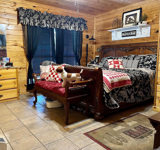 bedroom featuring light tile patterned floors, wooden ceiling, and wood walls