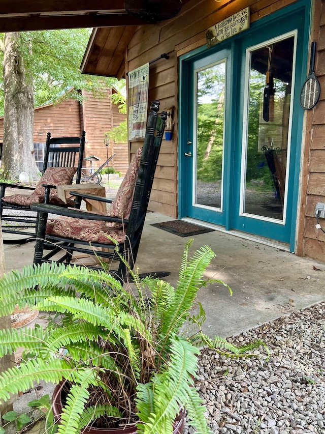 doorway to property with a patio