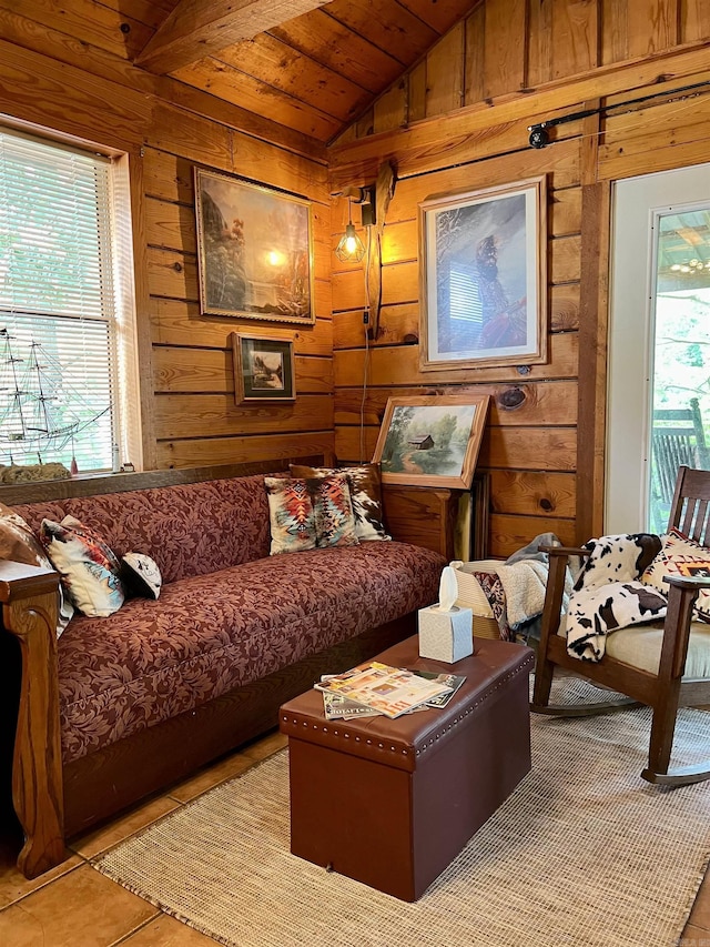 sitting room with lofted ceiling, light tile patterned floors, wooden ceiling, and wood walls