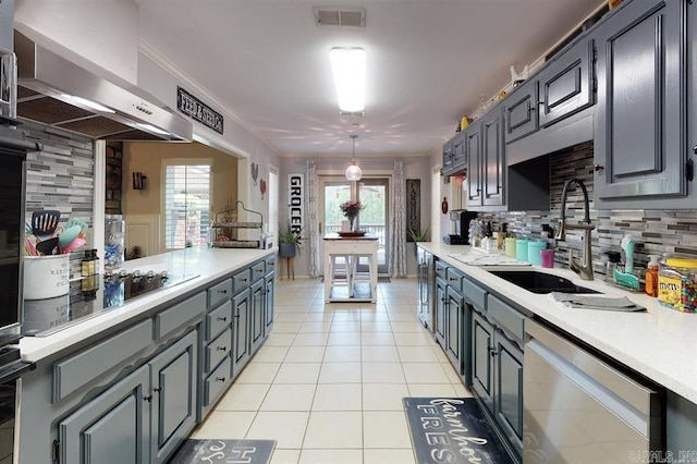 kitchen with wall chimney range hood, stainless steel dishwasher, decorative backsplash, ornamental molding, and a healthy amount of sunlight