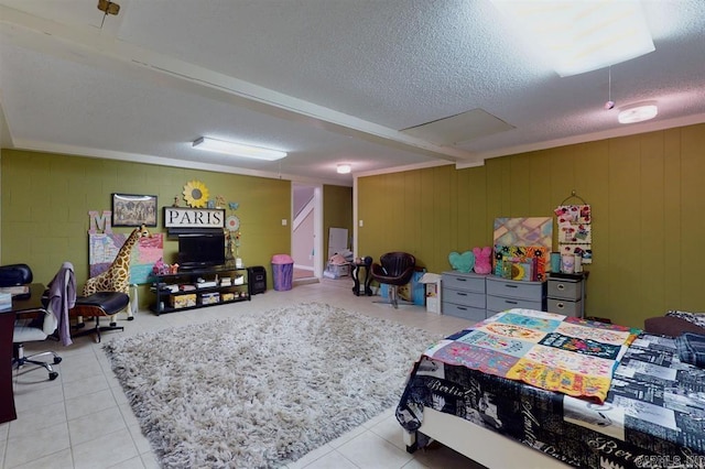 bedroom featuring a textured ceiling and light tile patterned flooring