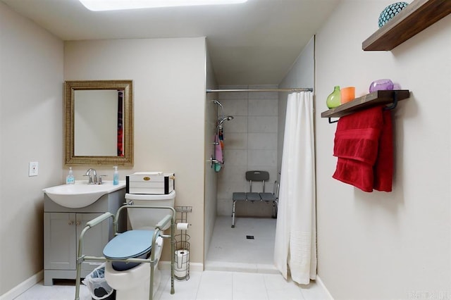 bathroom featuring tile patterned floors, vanity, a shower with shower curtain, and toilet