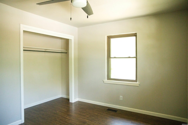 unfurnished bedroom with hardwood / wood-style floors, a closet, and ceiling fan