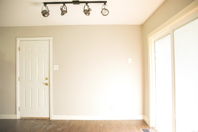 spare room with hardwood / wood-style floors