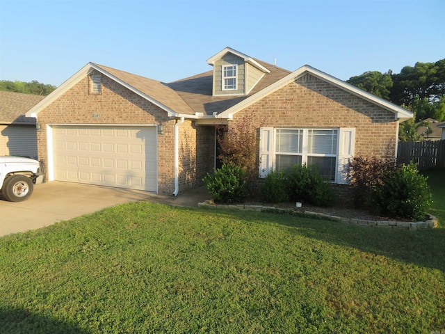 view of front of home with a garage and a front lawn