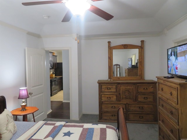 bedroom featuring ceiling fan, dark carpet, and crown molding