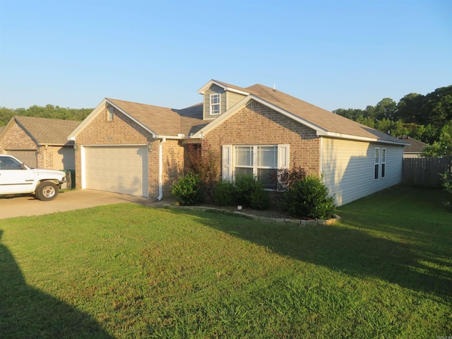 view of front of house featuring a front yard and a garage