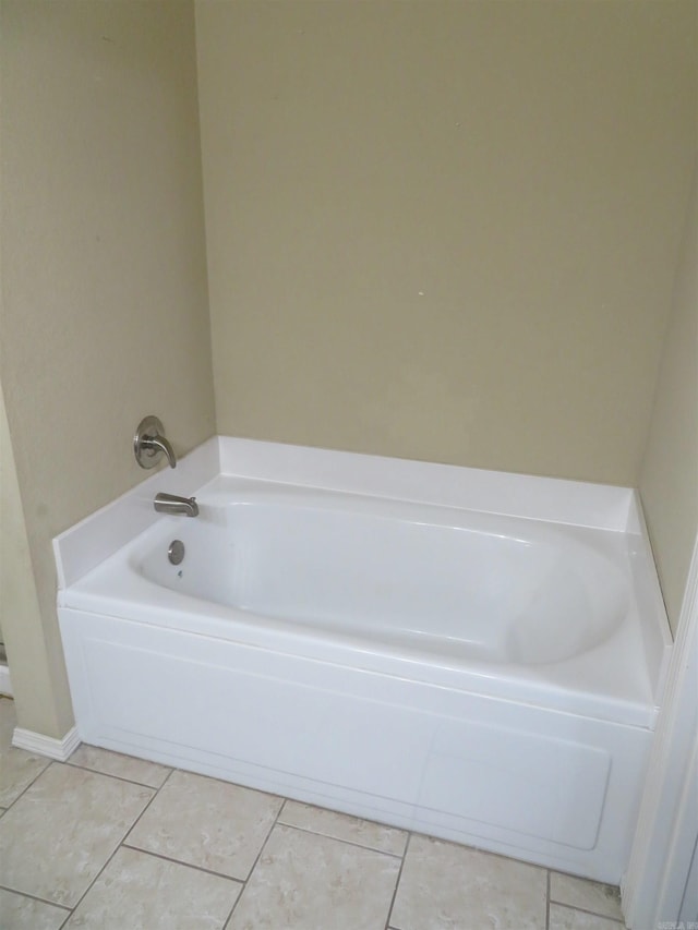 bathroom featuring a bath and tile patterned floors