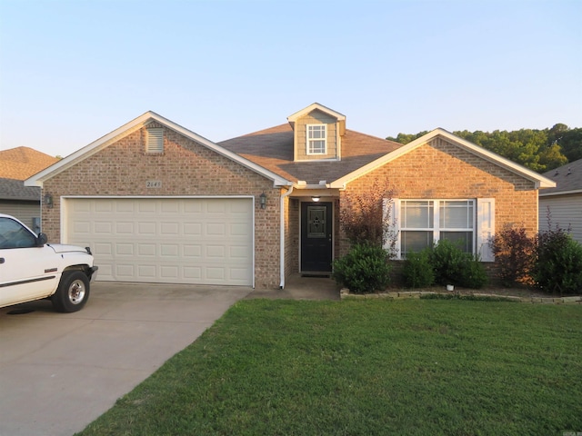 view of front facade with a front yard and a garage