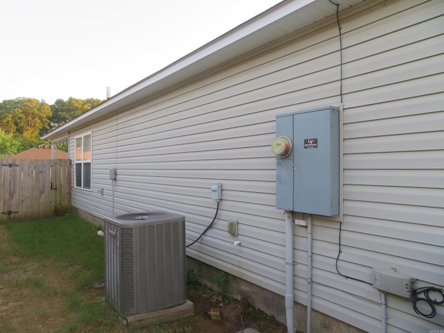 view of side of home featuring central AC unit