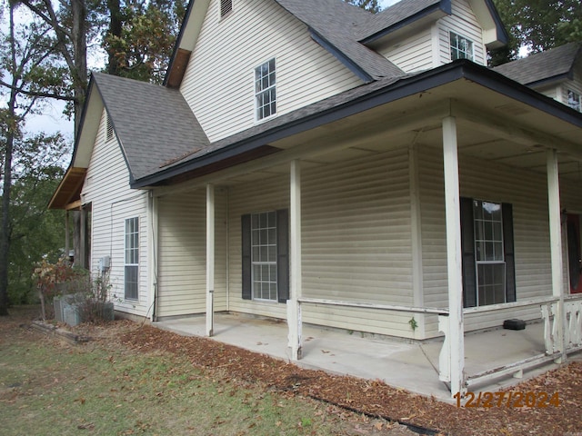 view of home's exterior featuring covered porch