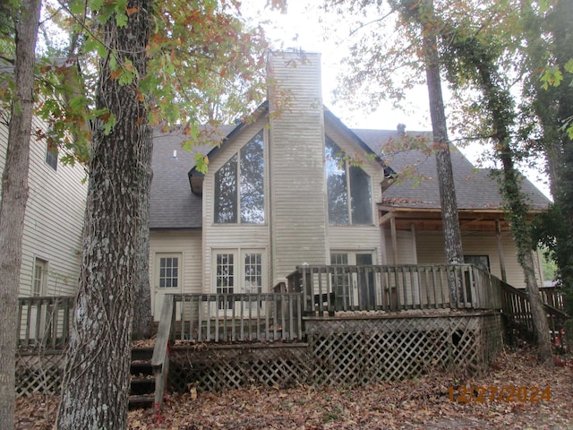 rear view of house with a wooden deck