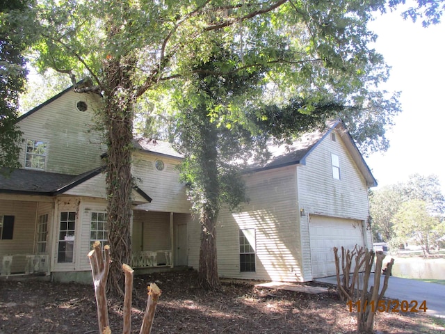 view of side of home with a garage