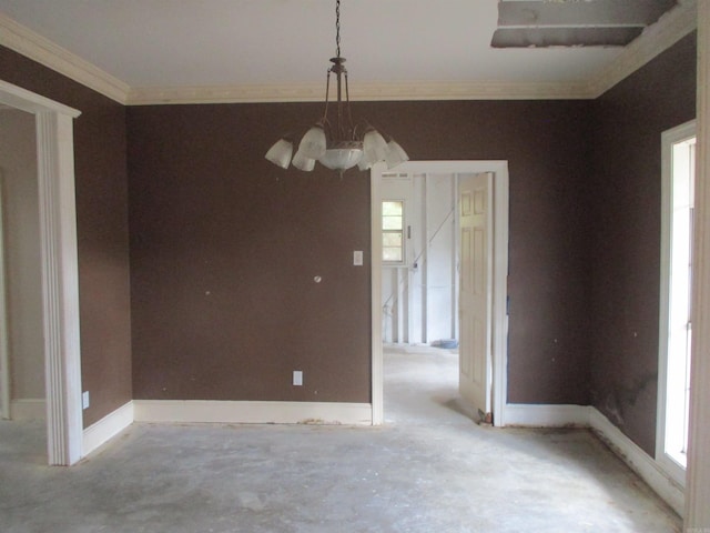 unfurnished dining area featuring a notable chandelier and crown molding