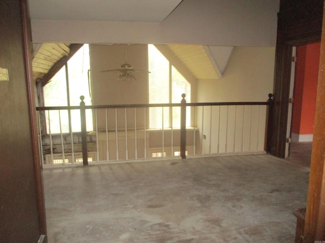 interior space featuring ceiling fan and vaulted ceiling