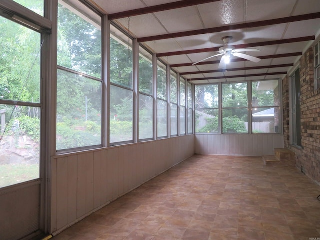 unfurnished sunroom with plenty of natural light and ceiling fan