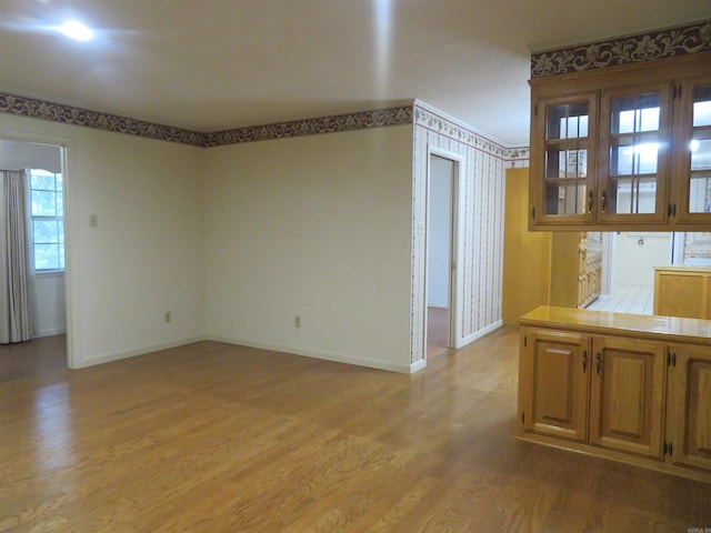 spare room with light wood-type flooring