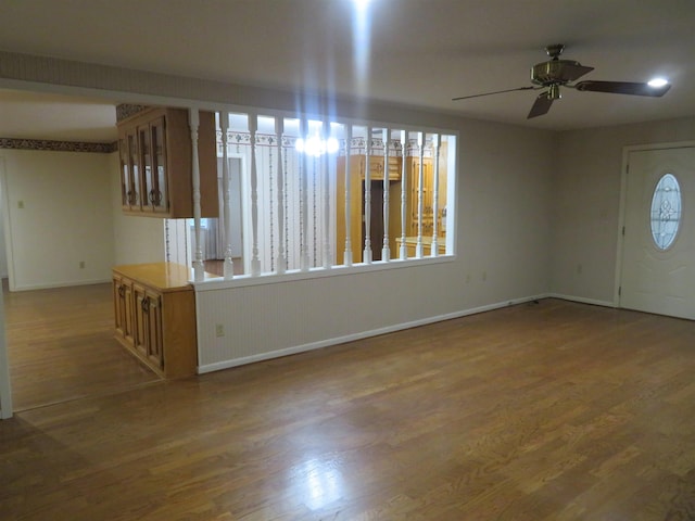 foyer entrance featuring dark hardwood / wood-style flooring and ceiling fan