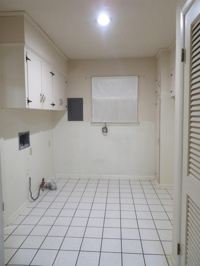 clothes washing area with light tile patterned floors, hookup for a washing machine, electric panel, and cabinets