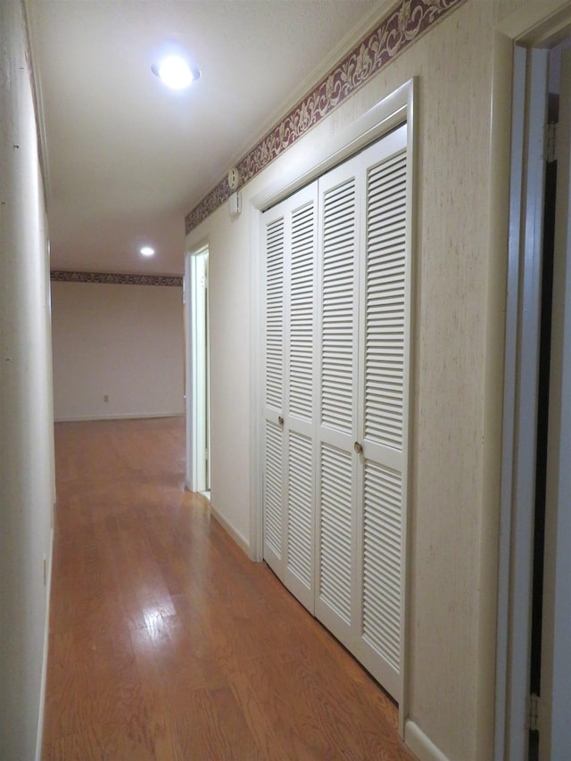 corridor featuring hardwood / wood-style floors