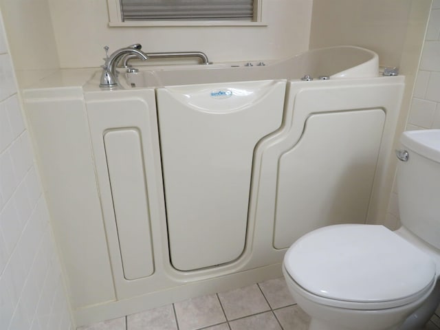 bathroom featuring tile patterned floors and toilet