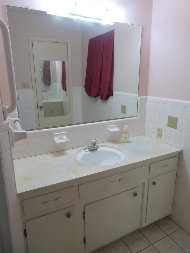 bathroom featuring tile patterned floors, vanity, and tile walls