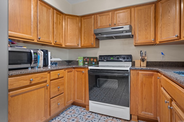 kitchen featuring white electric range