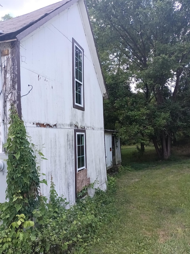 view of home's exterior featuring a yard