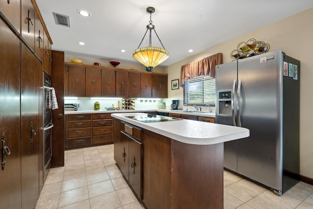 kitchen with black electric stovetop, a kitchen island, hanging light fixtures, stainless steel fridge with ice dispenser, and light tile patterned floors