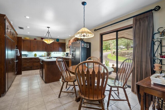 dining room with light tile patterned flooring