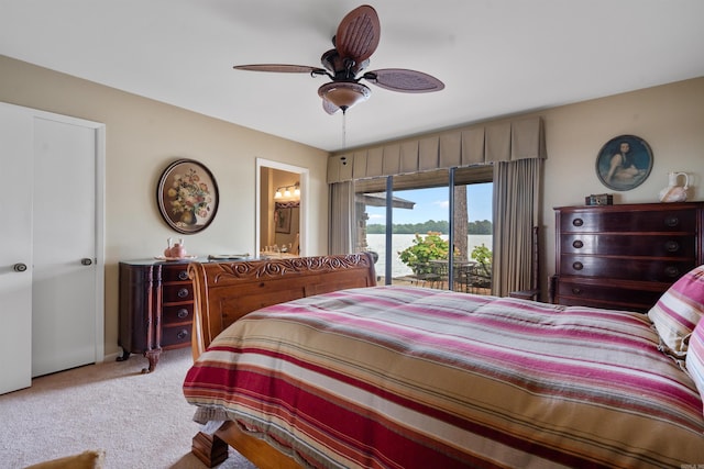 bedroom featuring ceiling fan, access to exterior, carpet flooring, and ensuite bath