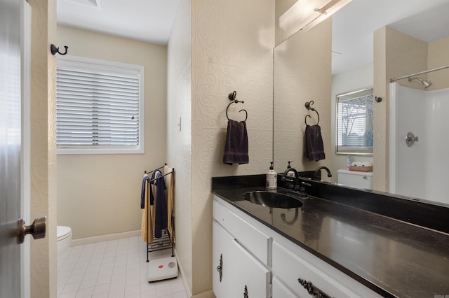 bathroom featuring a shower, toilet, and vanity