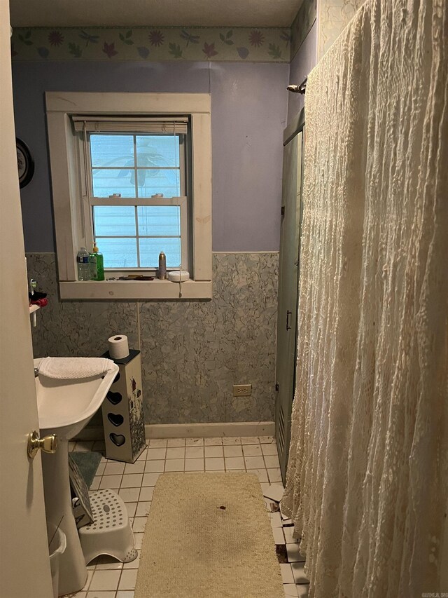 bathroom with tile flooring